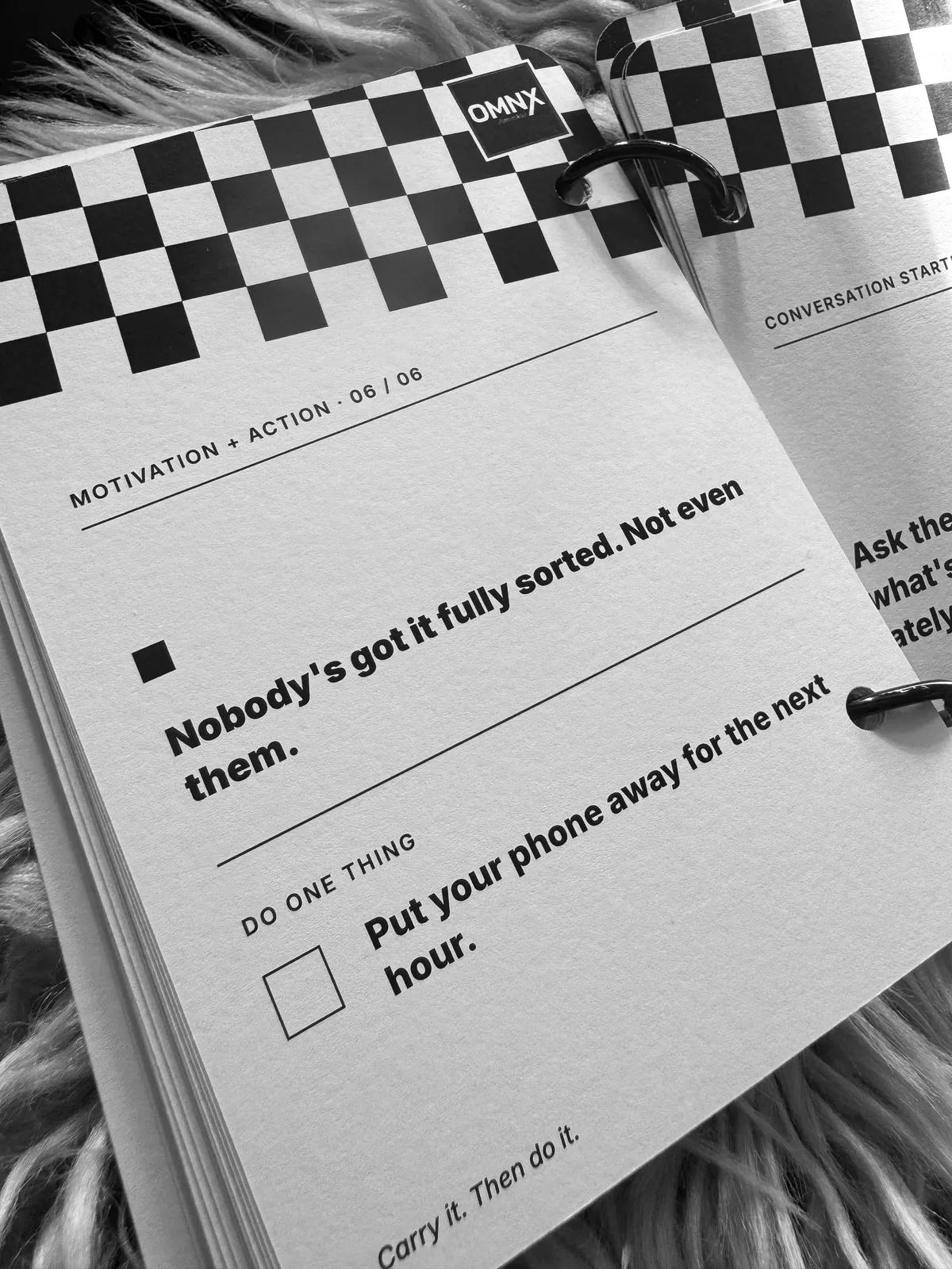 A motivation card reading Nobody's got it fully sorted. Not even them., with a tick box under DO ONE THING reading Put your phone away for the next hour.