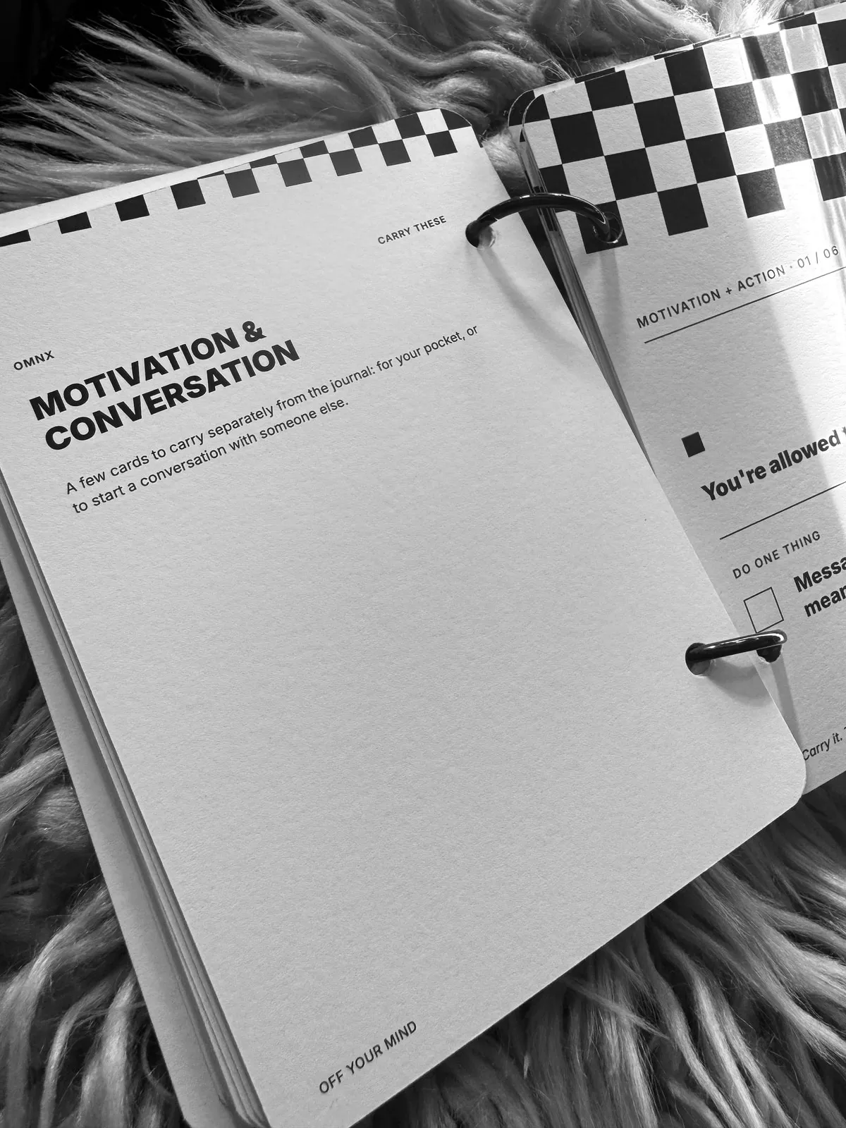 The MOTIVATION & CONVERSATION divider page, describing cards to carry separately from the journal, with the first card, MOTIVATION + ACTION 01 / 06 reading You're allowed, partly in frame beside it