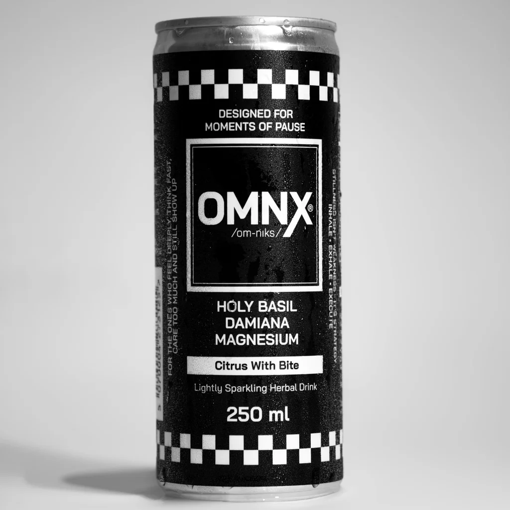 An OMNX 250ml can, front on, with condensation across the label
